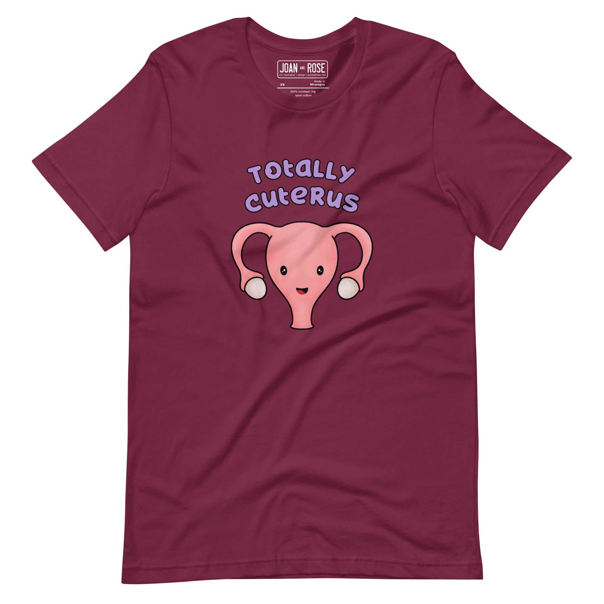 Maroon coloured t-shirt with an illustration of a cute uterus character smiling with the text in purple 'Totally Cuterus'